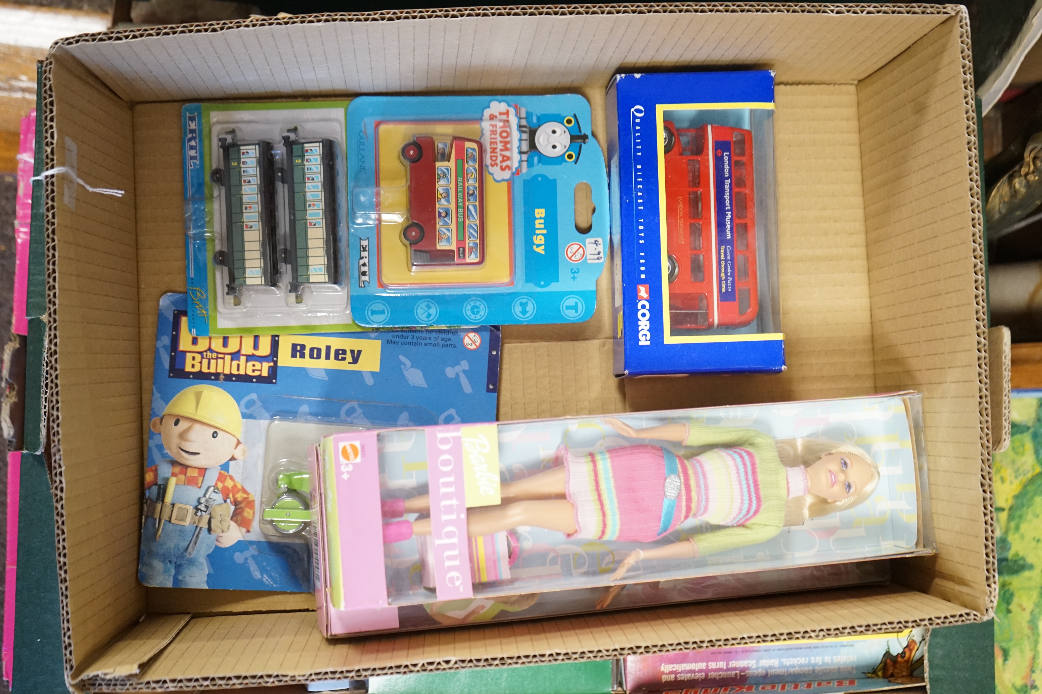 Forty six boxed diecast vehicles and play figures by Matchbox, Britains, EFE, Barbie, etc.